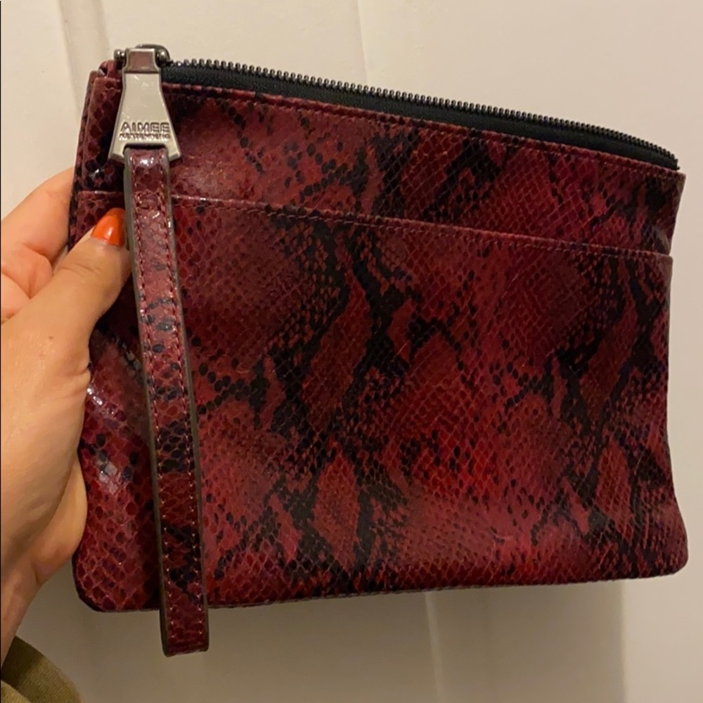 Red snakeskin clutch